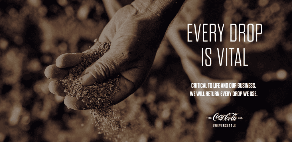 Coca-Cola "Every drop is vital" advert: hand letting dry soil fall, hashtag Never Settle