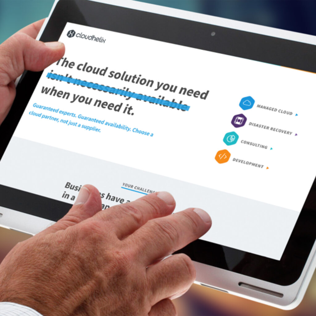 A person holding a tablet showing the CloudHelix website, its headline part-struck-through in blue, with managed cloud, disaster recovery, consulting and development listed alongside.