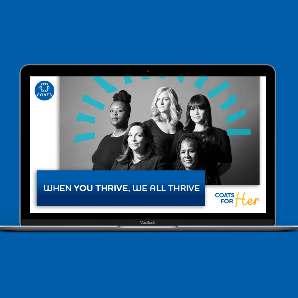 The Coats For Her campaign on a laptop screen, showing a black-and-white portrait of five women above the line "When you thrive, we all thrive".