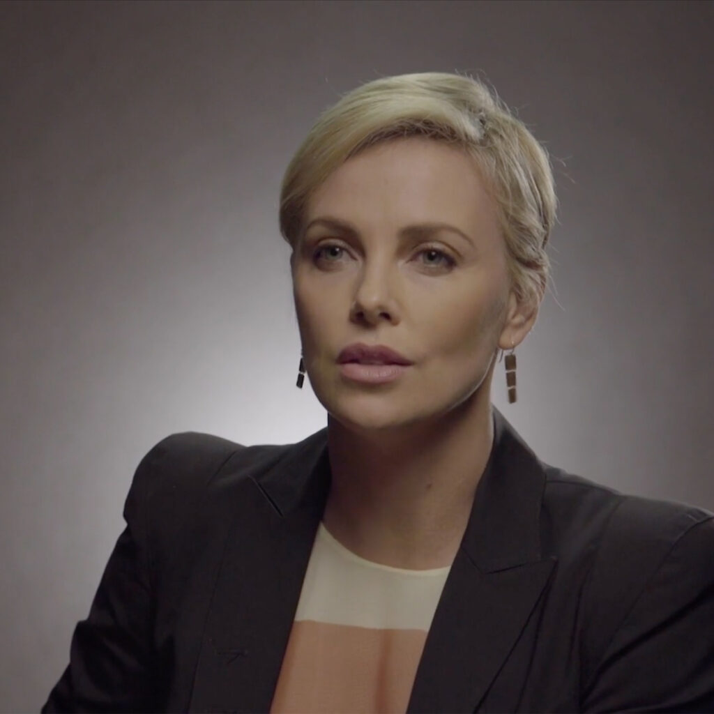 Charlize Theron speaking to camera in a filmed message supporting the End It For Good campaign.
