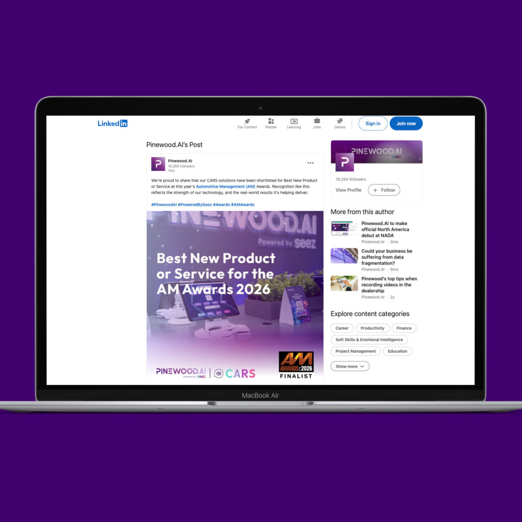 A laptop showing a Pinewood.AI LinkedIn post announcing that its CARS solution is a finalist for Best New Product or Service at the AM Awards 2026.